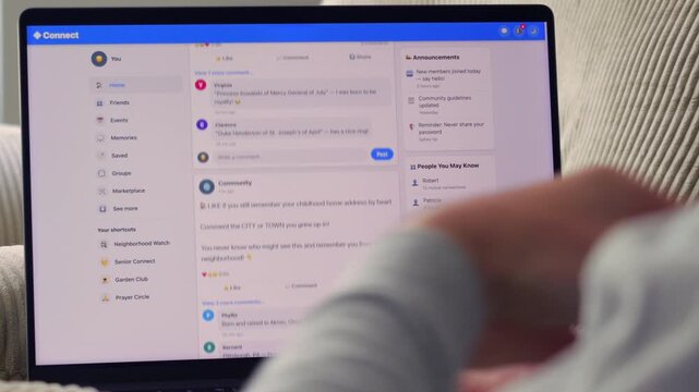 Older man using a laptop to answer social media quiz questions illustrating the dangers of oversharing personal data and cybersecurity risks