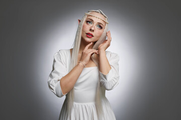 Naklejka premium Beautiful elf girl on grey gradient background