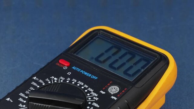 A digital multimeter for measuring the parameters of electrical circuits. Close-up. Soft focus.