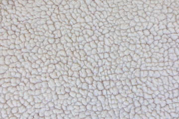 Detailed macro texture of faux shearling fabric soft fluffy textile background for design © Iryna Miadzvedzeva