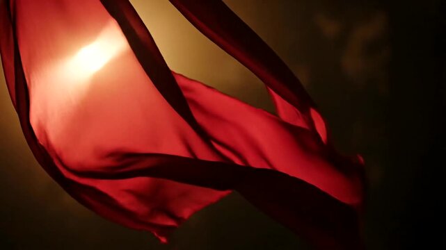 Red fabric flowing in light.