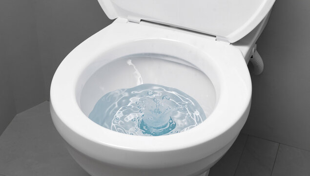 Clean bathroom toilet with vibrant blue cleaning solution.