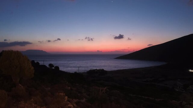 Amazing view of a colourful sunrise at the Theodoti beach in Ios Greece