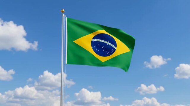 The Brazil flag flies against a bright blue sky.