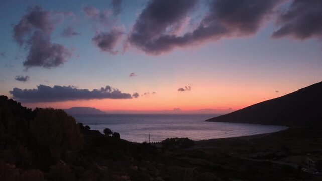 Beautiful view of a colourful sunrise at the Theodoti beach in Ios Greece