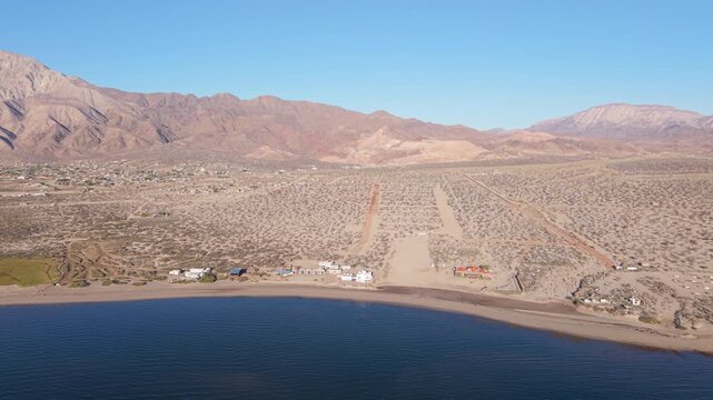 Watch the sunrise light up Bahia De Los Angeles in Baja California while revealing the beach and camping areas along the shore.