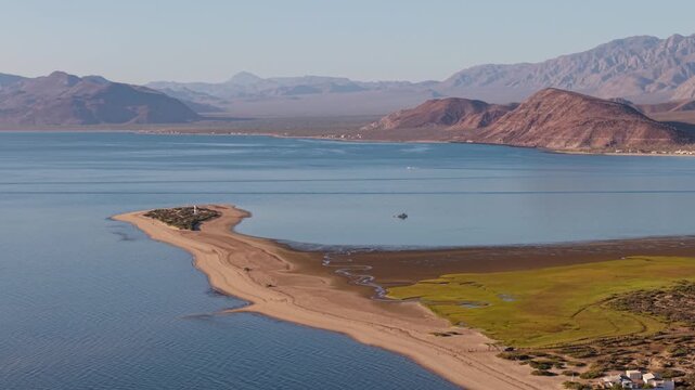 Aerial views capture sunrise over Bahia De Los Angeles, highlighting beaches and camping spots in Baja California Mexico.