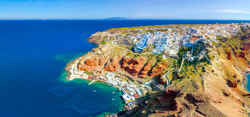 Naklejka premium Oia town on Santorini island, Greece. Traditional and famous houses and churches with blue domes over the Caldera, Aegean sea