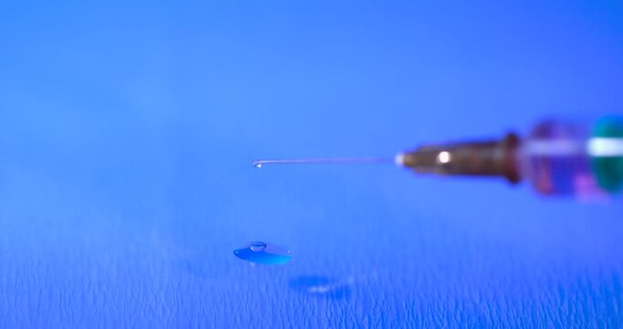 Super Slow Motion Syringe Needle Droplet Closeup 