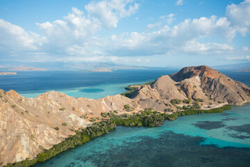 Aerial view of Pulau Siaba Besar island on a sunny tropical day © Hector