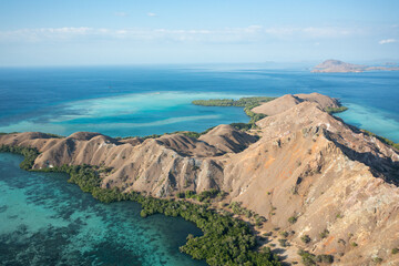 Aerial view of Pulau Siaba Besar island on a sunny tropical day © Hector