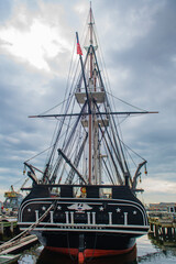 Fototapeta premium USS Constitution is a three masted wooden hulled heavy frigate of the United States Navy docked at Charlestown Navy Yard in Boston, Massachusetts MA, USA. She is the world's oldest ship still afloat. 