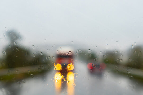 Driving in the rain facing a truck with its headlights on - France