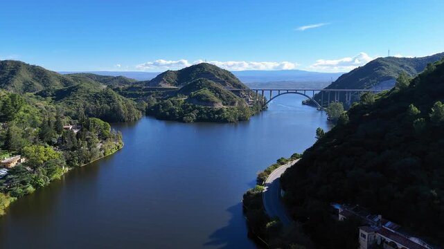 Aerial view of jose manuel de la sota bridge over san roque lake in cordoba, argentina