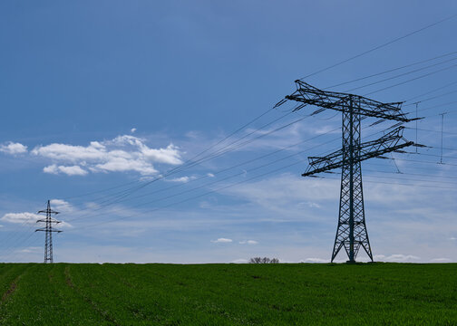 Energy Industry: Overhead high-voltage power line with a two-level anchor and a three-level dead-end tower