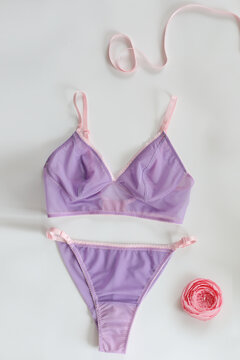 Set of glamorous stylish sexy lace lingerie on bedsheets. Shopping and fashion concept. Beauty, fashion blogger concept. Female bra, Lingerie advertising, flat lay top view copy space