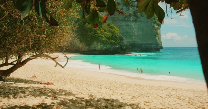 Coastal view of Kelingking Beach with rocky cliffs on Nusa Penida Island Bali