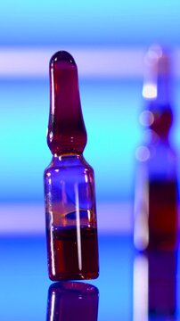 Super Slow Motion Closeup Of Ampoule With Swirling Microbubbles And Glossy