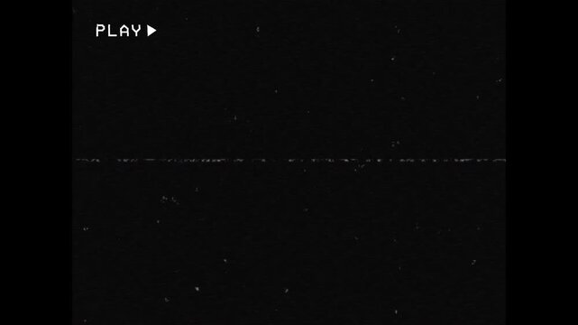 Old damaged VHS tape playing with heavy signal glitch, analog static noise and magnetic distortion, with a blinking PLAY text. Realistic retro VFX for creative projects. Infinite loop. 3x4.