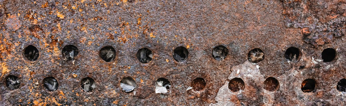 Texture old weathered worn messy obsolete dirty barbecue rust round brown holes rusty pattern abstract