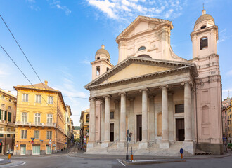 Obraz premium A large neoclassical church with tall columns in the old square of Genoa.