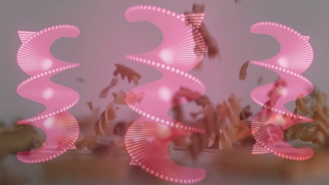 Stream releasing above, fusilli falling, tumbling, settling into low piles over three pink spirals