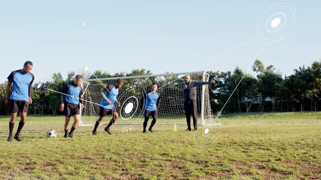 Vertical video: Coach signaling soccer team doing high knees toward goal, HUD tracking for training