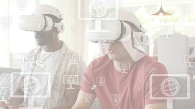 Two men sitting on sofa operating controllers and activating HUD screen and globe icons for gaming