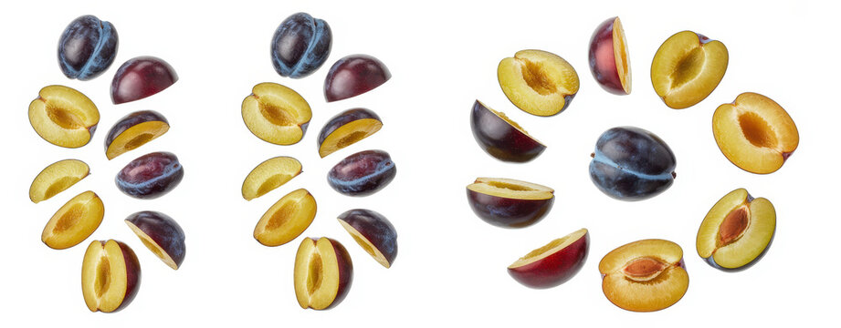 Collection of sliced and whole purple plums arranged in circular patterns on white background