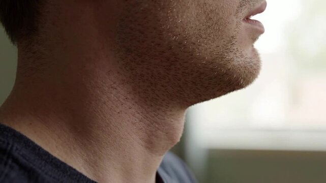 Side view of subtle swallowing with Adam's apple movement close up