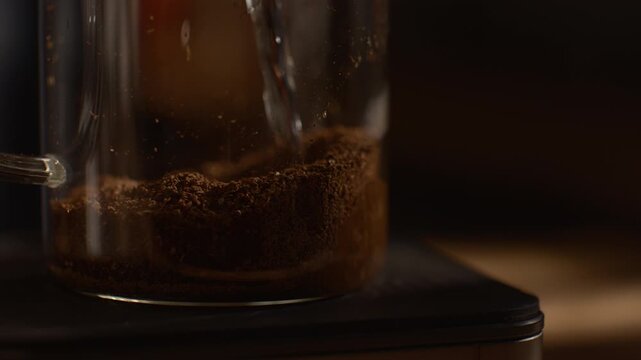 French press coffee brewing, hot water infusion and stirring, rich texture, dark cinematic atmosphere with natural light rays.