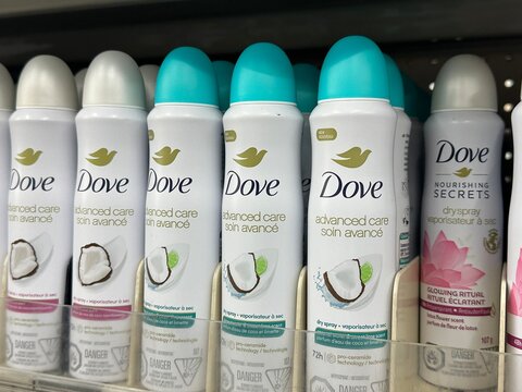 Dove body deodorant and antiperspirant spray products on retail display shelf. April 30 2026. Strathmore, Alberta, Canada. For editorial use only.