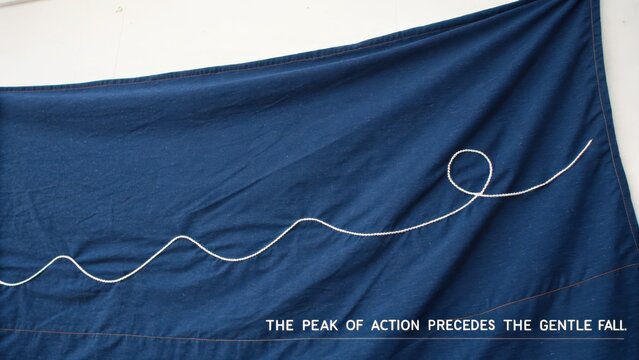 White Thread Line on Blue Fabric with Text