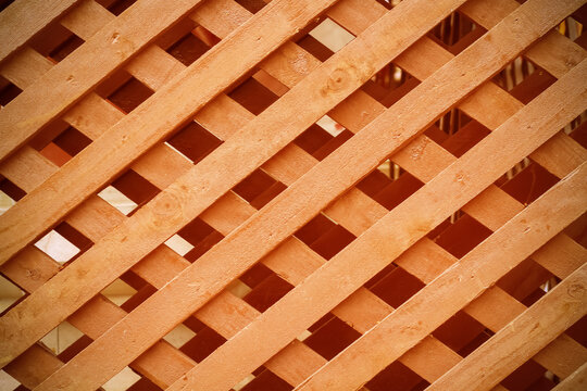 Brown wood fence interlace patterns