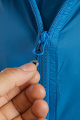 close - up of a zipper of a man 's hand © Claudio