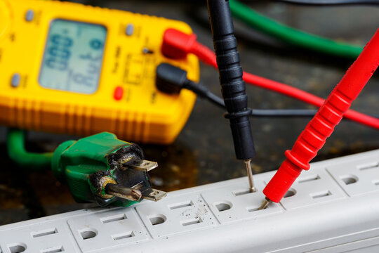 Multimeter Testing Damaged Electrical Cord
