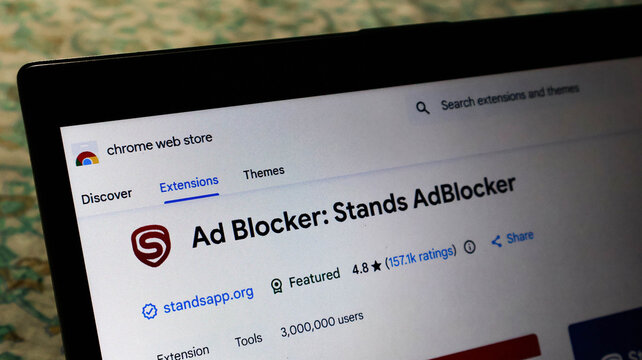 Closeup of the stands adblocker extension page on the chrome web store on a laptop screen