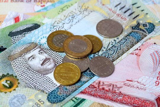 Bahraini dinar money bills and coins on table. Bahrain cash of BHD currency close up