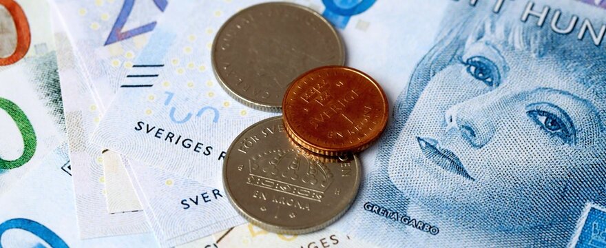 Swedish krona money bills and coins on table. Sweden cash of SEK currency close up