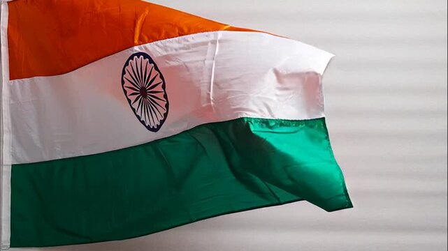 Vibrant national colors of India's esteemed flag gently waving, symbolizing unity, pride, and the rich cultural heritage of a diverse nation