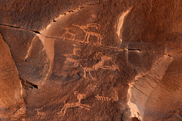 Historic rock art of a flute playing bighorn sheep at Sand Island Petroglyphs, Utah © Sumiko Scott