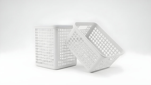 Two white plastic baskets are stacked on a plain surface indoors