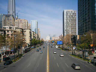 Fototapeta premium High angle view of multi-lane city highway with traffic and modern skyscrapers
