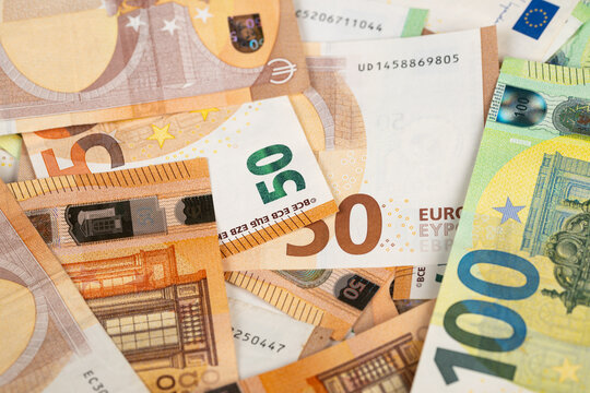 Visual representation of financial strain through currency and microprint. Detailed scene illustrating economic pressure with overlapping euro bills and hologram features