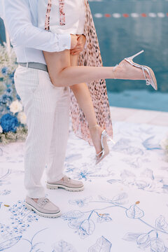 An intimate wedding celebration with water backdrop during sunset