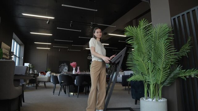 Elegant woman using a lectern digital menu in a modern restaurant
