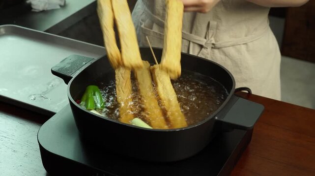 Adding Fish Cake Skewers to Boiling Broth &ndash; Korean Street Food Close Up 4K