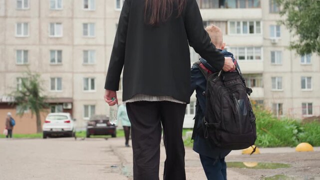 Kid moves securely. Child carefully follows adult guidance. Youngster navigates safely with attentive supervision. Juvenile advances safely through diligent oversight and attentive parental guidance