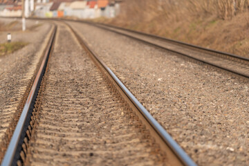 Fototapeta premium Closeup of solitary rail contrasted with textured gravel and mood. Detailed depiction of lone railway track with surrounding textures and abstract emotional tone