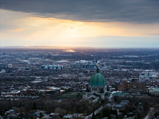 Fototapeta premium Aerial view of St. Josephs Oratory of Mount Royal at Sunset in winter. Montreal, Quebec, Canada